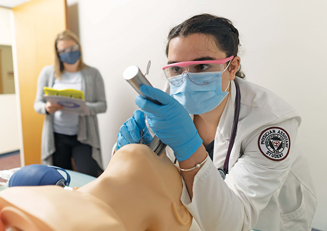 Physician assistant student works in a simulation lab