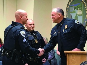 2010 Weare (N.H.) Police Department Police Chief Sean Kelly, at right, promotes Ryan Frisbie, at left, to the rank of sergeant.