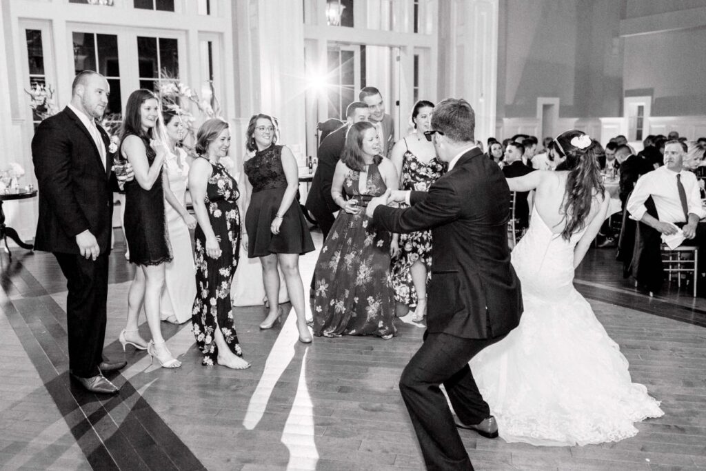 A Little Red Wagon cheer off between the bride and groom and their Springfield College friends took place at the wedding of Melissa Milich and Ryan O’Rourke.