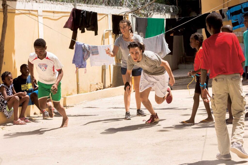 Students on the Alternative Spring Break trip to Haiti engage children at the Have Faith Haiti Mission orphanage, created by author and last fall’s Arts and Humanities speaker Mitch Albom, through games and other activities.