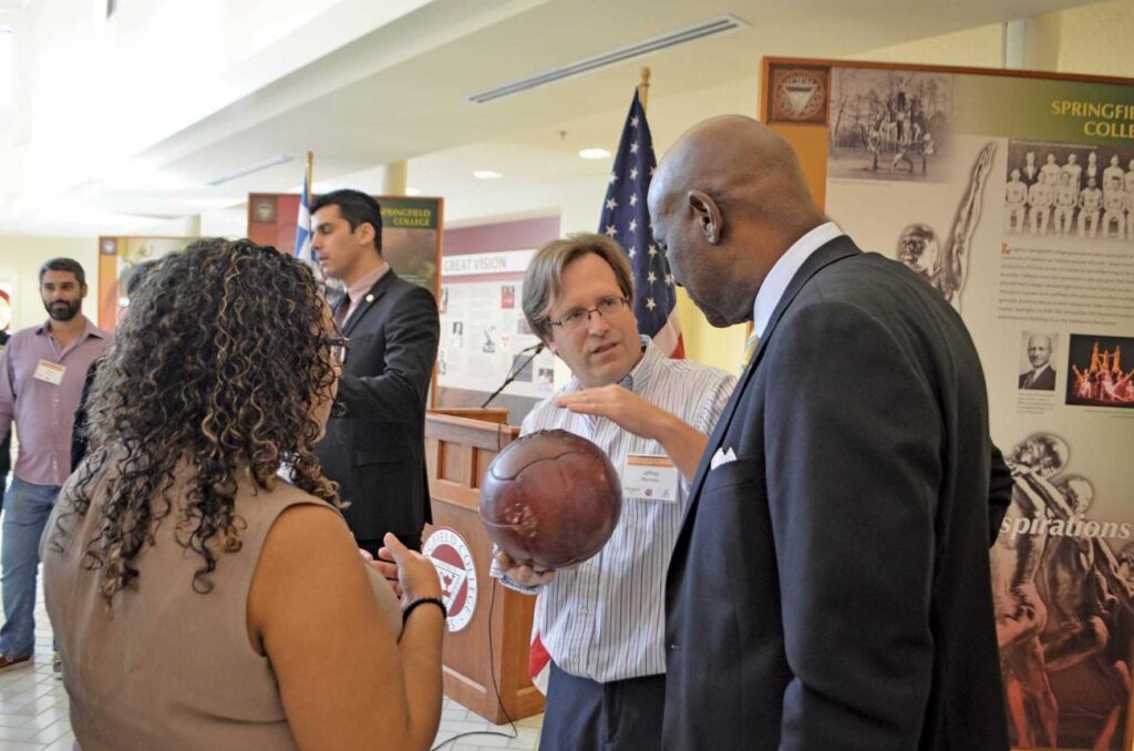 Jeffery Monseau explains basketball history in the Springfield College Museum.