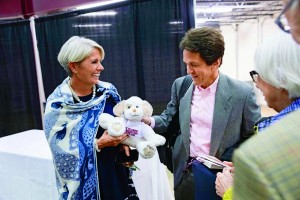 President Cooper presented Albom with a stuffed puppy