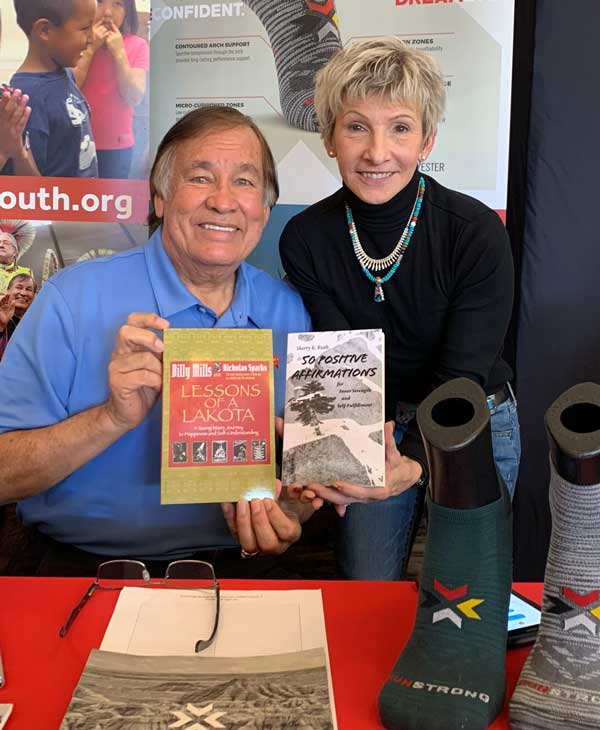 Sherry Kopko Ruth with 1964 Olympic gold medalist Oglala Lakota Billy Mills at a book signing event