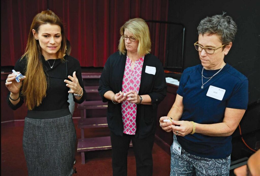 Allison Burns of End Mass Overdose works with physical therapy professors Kimberly Nowakowski and Julia Chevan.