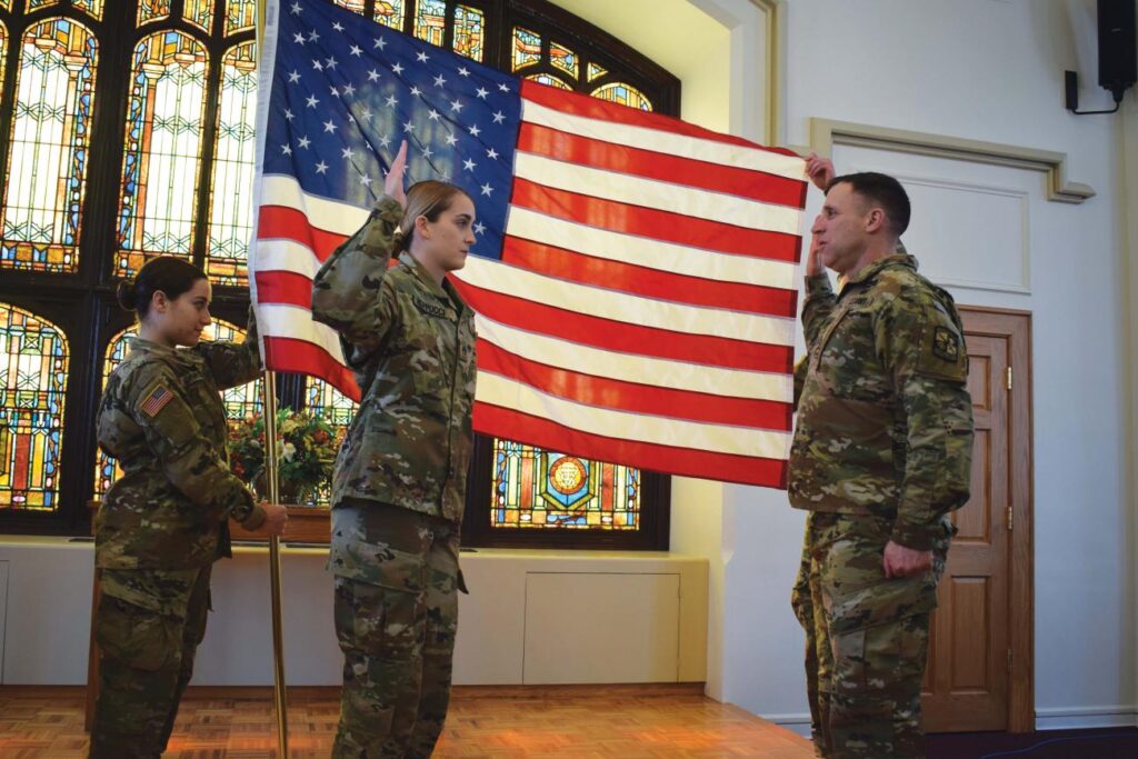 Student Madelyn Reppucci, second from left, at her ROTC swearing-in ceremony in Marsh Memorial Chapel
