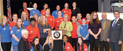 Springfield College AmeriCorps members are celebrated by Springfield Mayor Domenic Sarno, right, during the Mayors Day of Recognition for National Service, as they implement the Massachusetts Reading Corps program at the Boland Elementary School.