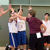 Coach Naomi Graves works with Hong Kong Baptist University men’s basketball program