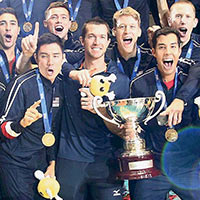Springfield College head men’s volleyball coach Charlie Sullivan, fourth from right, with the FIVB World Cup Champion U.S. Men’s Volleyball Team